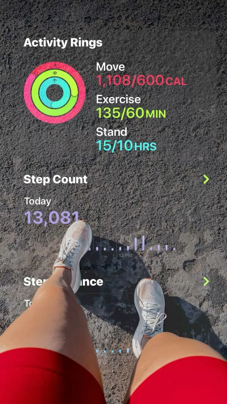 Activity-rings screenshot over a run POV